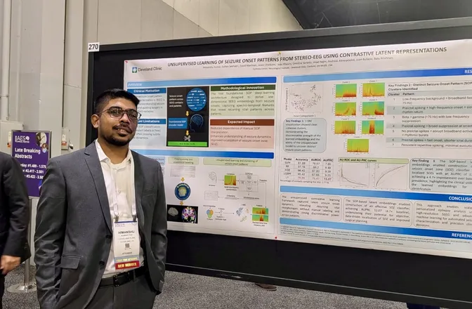 Himanshu Kumar standing beside his stereo-EEG seizure-onset poster at the AES 2025 Annual Meeting